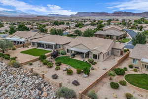 Aerial view of residential area featuring a mountainous background