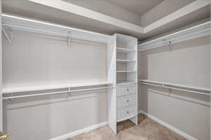 Walk in closet with light tile patterned flooring