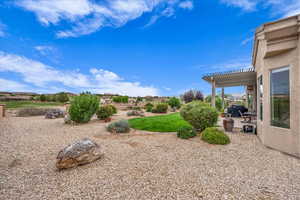 View of yard featuring a patio area and a pergola