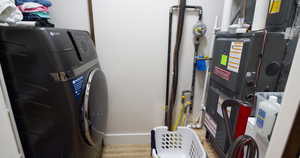 Washroom with washer / dryer and heating unit