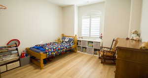 Bedroom with light wood-type flooring