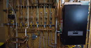Utility room featuring water heater