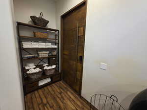Corridor with dark wood-style floors