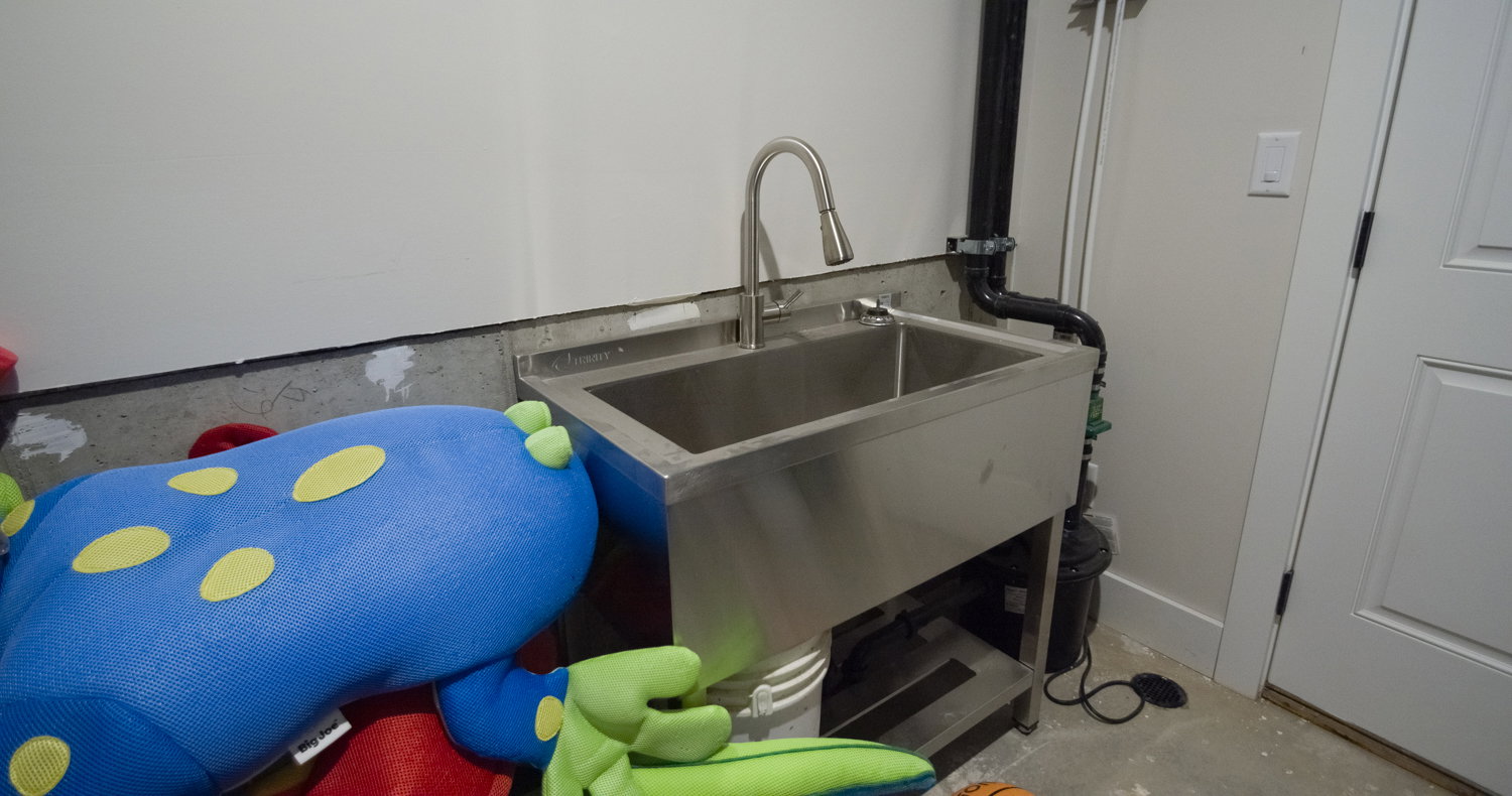 Detailed view of concrete flooring and a sink
