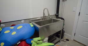Detailed view of concrete flooring and a sink