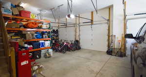 Garage featuring a garage door opener