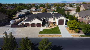View of front of property featuring concrete driveway, a residential view, stucco siding, and a garage