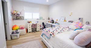 Bedroom featuring light wood-style flooring and recessed lighting