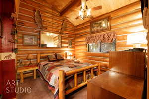 Carpeted bedroom featuring wooden ceiling, log walls, and a ceiling fan