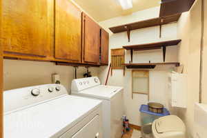Laundry room with washing machine and dryer and cabinet space