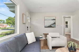 Living room featuring wood finished floors and baseboards