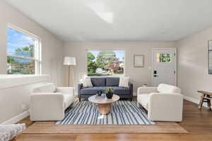 Living room with wood finished floors and recessed lighting