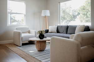 Living room with wood finished floors and baseboards