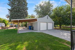 Garage featuring a detached garage