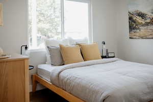 Bedroom with dark wood finished floors