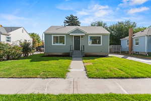 Bungalow-style home with roof with shingles