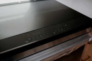 Kitchen view of stainless steel range with electric cooktop
