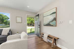 Entrance foyer with wood finished floors, healthy amount of natural light, and recessed lighting