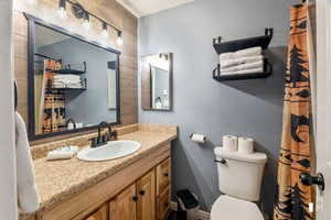 Bathroom featuring vanity and a shower with shower curtain