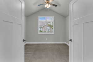 Den/bedroom with ceiling fan, and vaulted ceiling