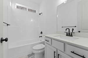 Full bathroom featuring tub / shower combination and vanity