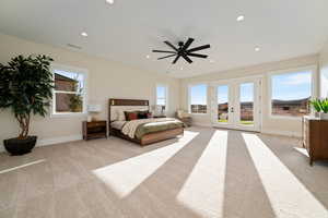Bedroom with french doors, light colored carpet, recessed lighting, ceiling fan, and access to outside