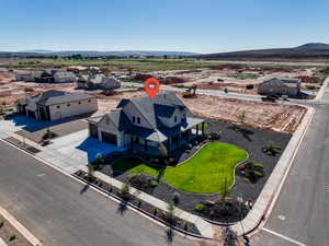 Aerial perspective of suburban area featuring a mountainous background