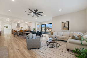 Living room featuring recessed lighting, light wood finished floors, and ceiling fan