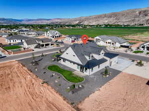 Aerial perspective of suburban area with a mountain backdrop