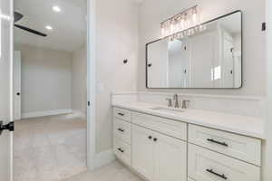 Bathroom with vanity and recessed lighting