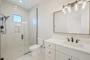 Bathroom with vanity, a stall shower, light tile patterned flooring, and recessed lighting