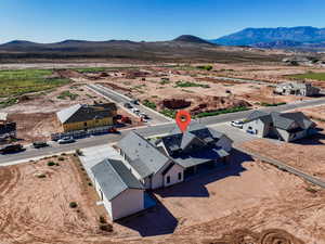 Aerial view of sparsely populated area featuring a mountain backdrop