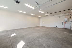 Garage featuring a garage door opener