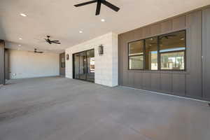 View of patio featuring ceiling fan
