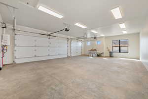 Garage featuring tankless water heater