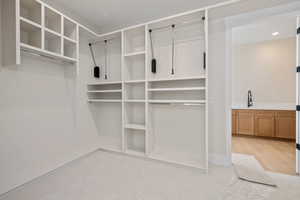 Spacious closet featuring a sink