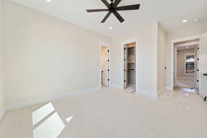 Unfurnished bedroom with recessed lighting, carpet, and a ceiling fan