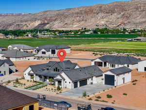 Aerial view of residential area featuring a mountainous background
