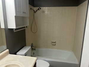 Bathroom featuring shower / washtub combination and vanity