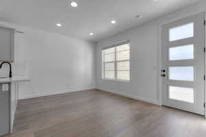 Foyer entrance featuring recessed lighting, a textured ceiling, and light wood finished floors