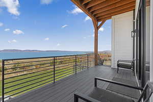 Wooden terrace with a water and mountain view