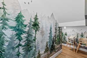 Interior space featuring wood finished floors and lofted ceiling