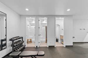 Exercise area with baseboards and recessed lighting