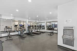 Exercise room featuring recessed lighting