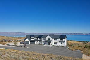 View of subject property with mountains