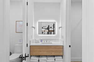 Bathroom with vanity and toilet