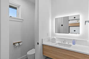 Bathroom featuring vanity and toilet