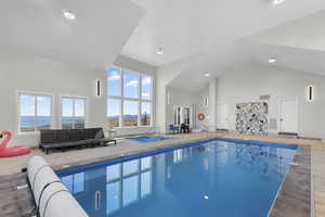 Indoor pool featuring a sunroom