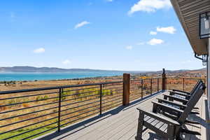 Wooden terrace with a water and mountain view