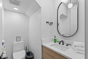 Bathroom with vanity and toilet